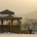 A gazebo in winter with early Christmas decorations